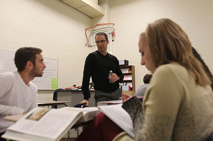 Paganelli in his AP History class at Wyoming High in Michigan. His students, he says, can be tougher on him after games than NFL players are.